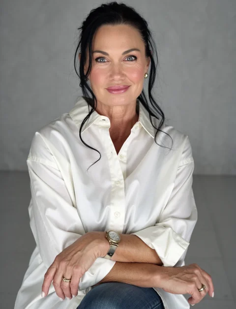 Melanie Cox in a white shirt